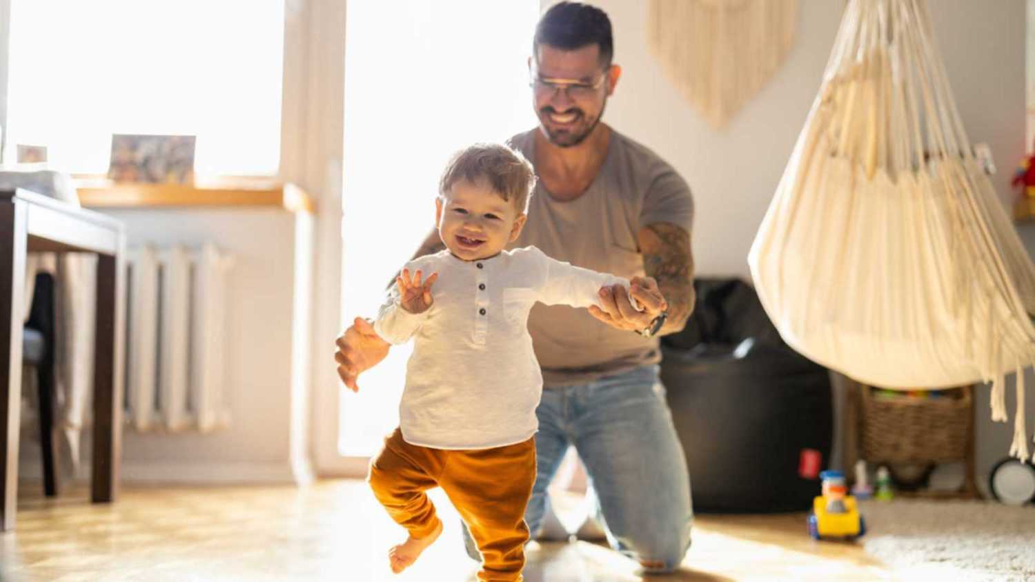 Man playing with baby