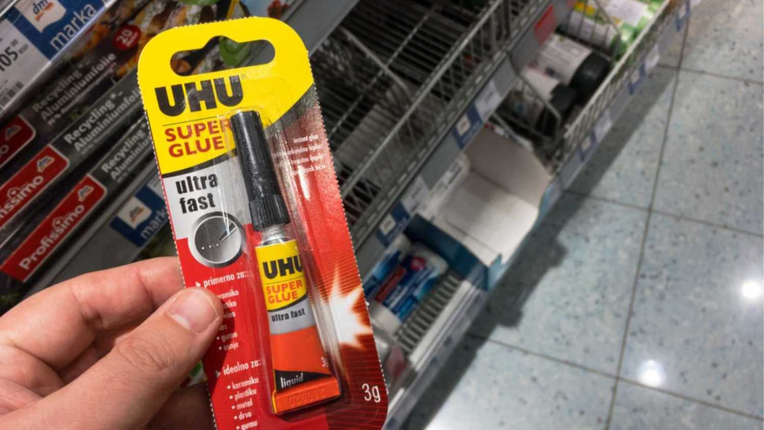 BELGRADE, SERBIA - MAY 29, 2021: UHU logo on a tube of super glue for sale in belgrade. UHU is a german manufacturer and retailer of adhesives, known for its glu and superglues.