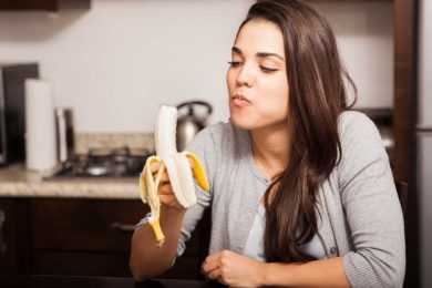 Woman eating Banana