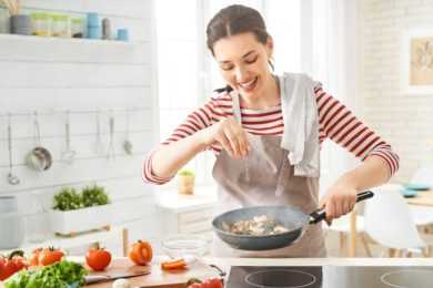 Woman cooking in kitchen