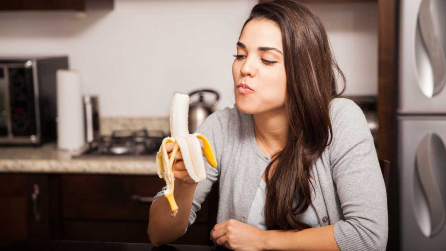 Woman eating Banana