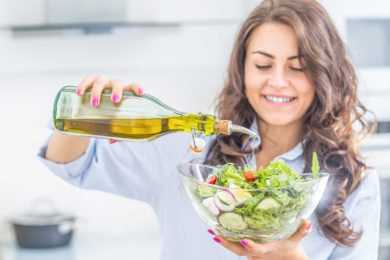 Woman having salad dressing