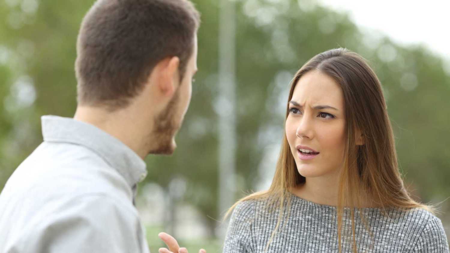 Woman talking rude and confident to man