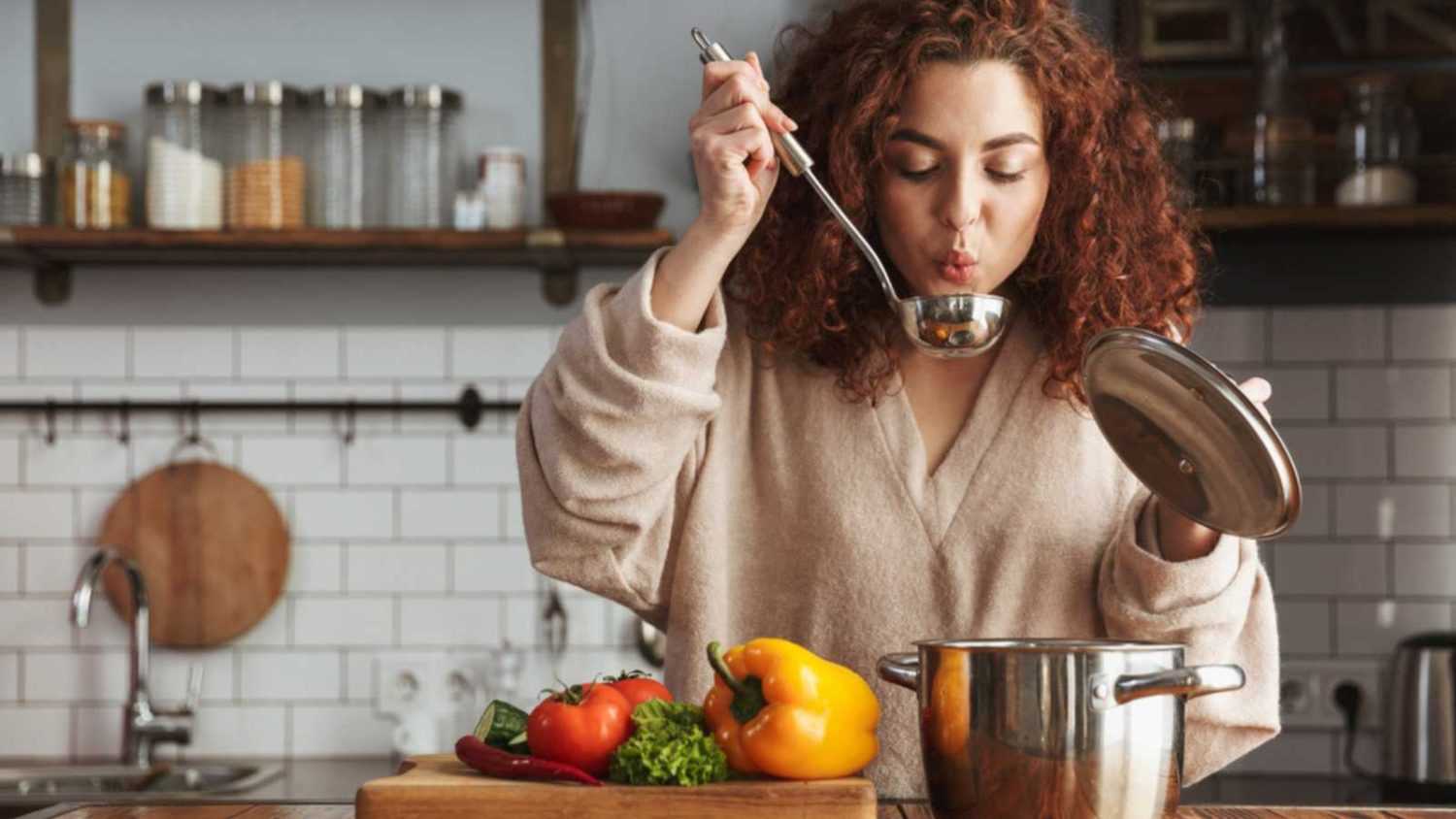 Woman drinking soup