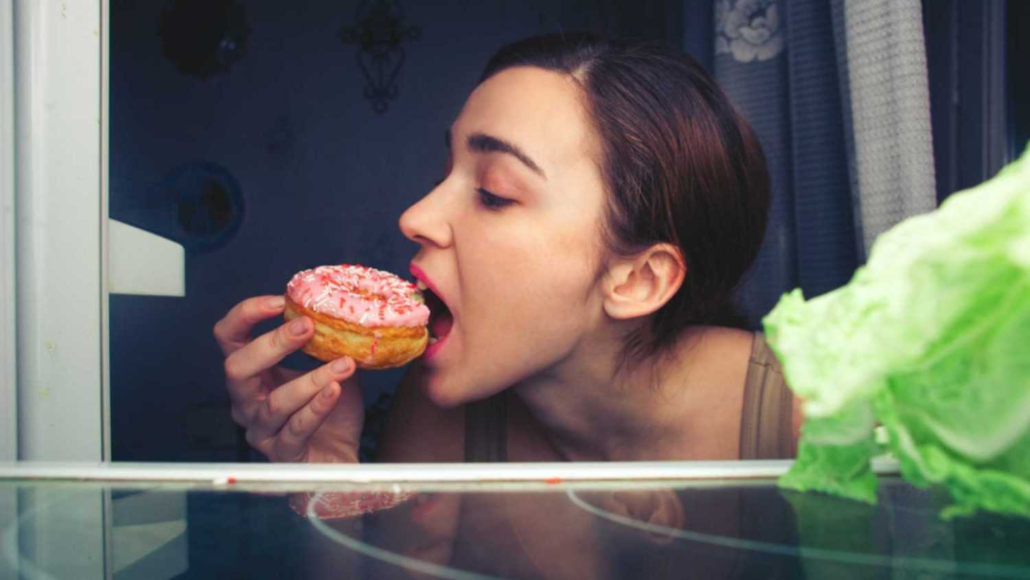 Woman eating donut