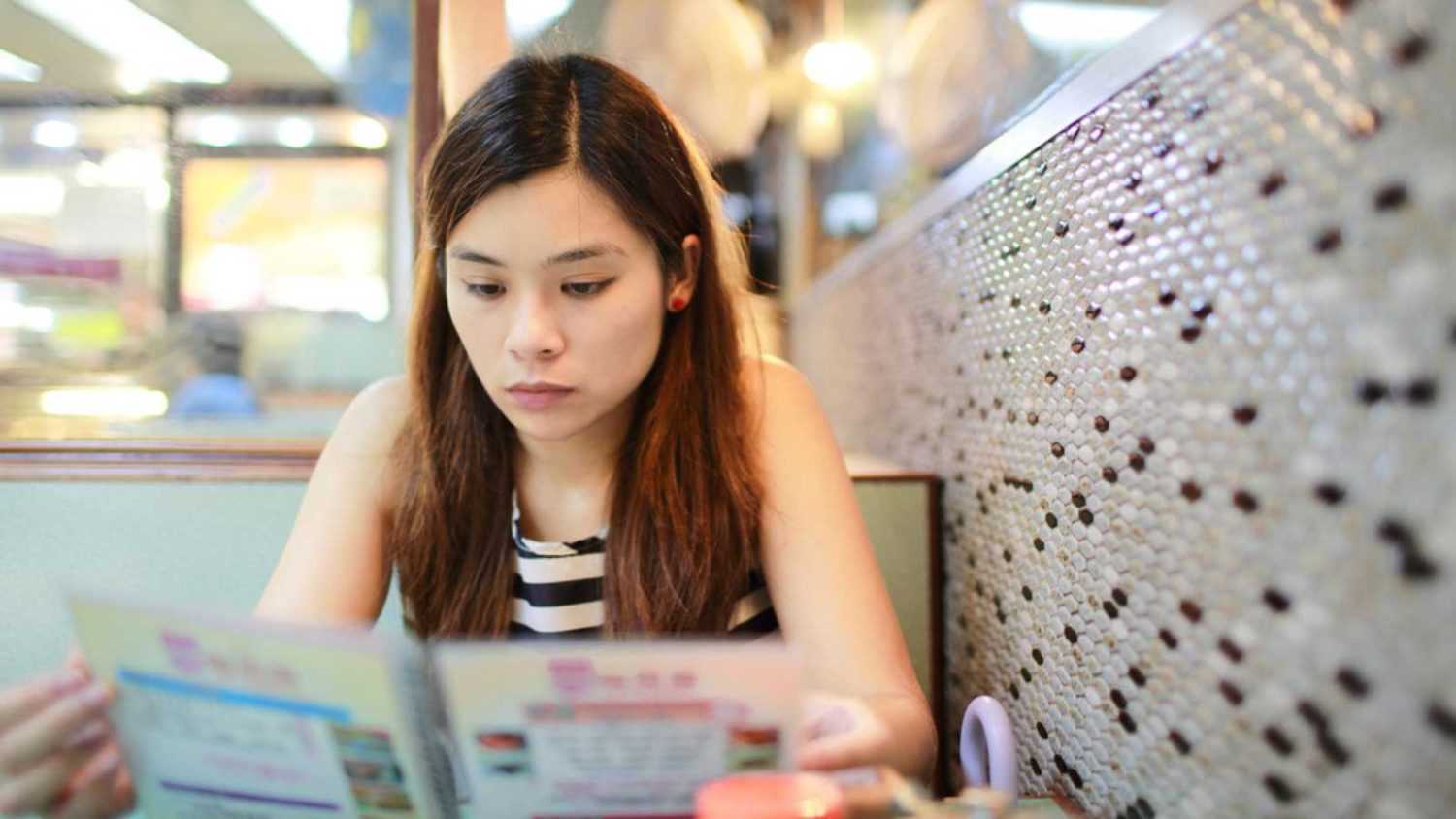 Woman checking Menu