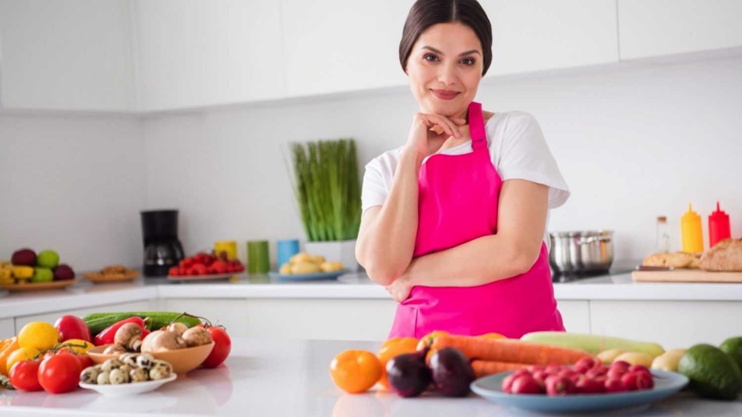 Happy Young Woman cooking