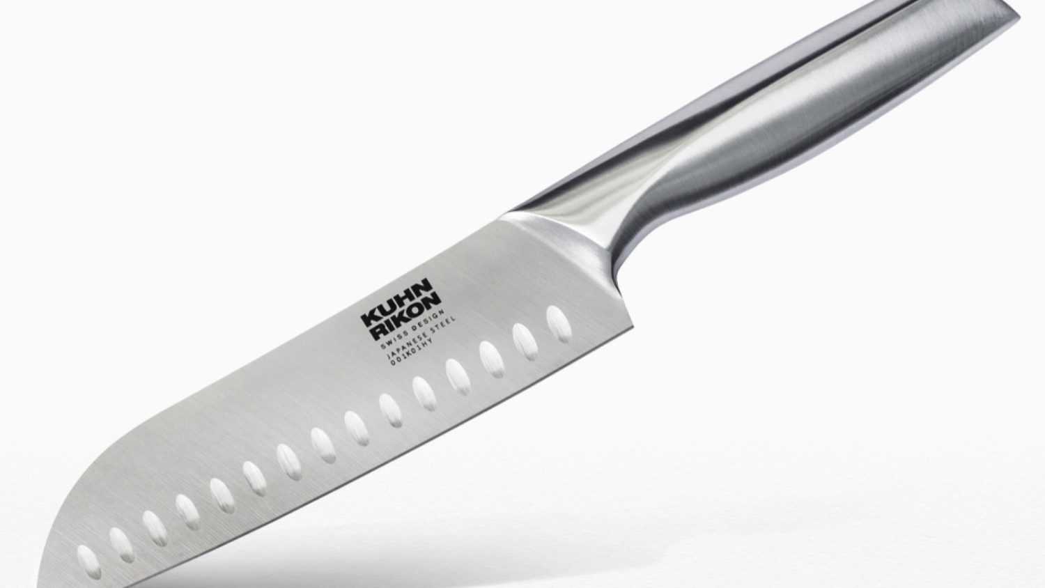 Studio shot of Kuhn Rikon Stainless steel Santoku kitchen all purpose knife, Swiss design, Japanese steel 001J05HY, set on white backdrop 