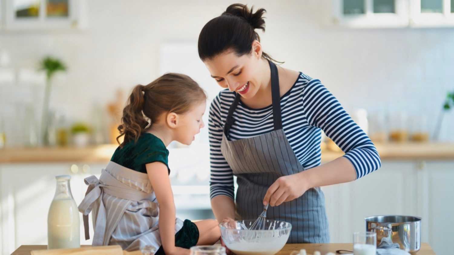 Woman baking with her daughter