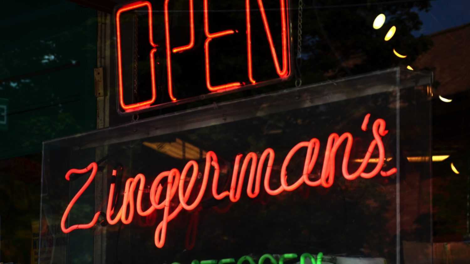 ANN ARBOR, MI - AUGUST 3: Neon sign in Zingerman's deli window in Ann Arbor, MI on August 3, 2014. Zingerman's co-owner Paul Saginaw has lobbied to increase the minimum wage.