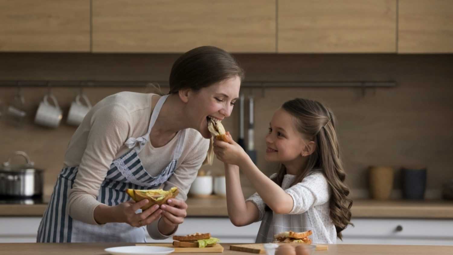 Woman and daugter making sandwich