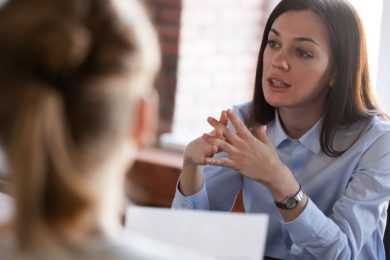 Bold woman talking to interviewer