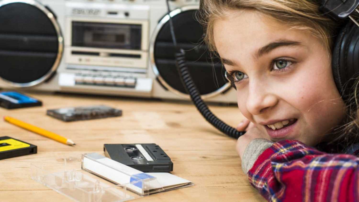 Young girl listening to radio